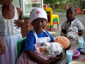 Children in an Educare center playing dress up