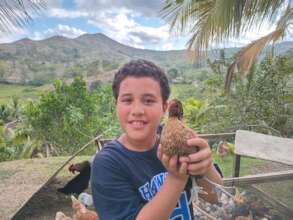 Kiki helps raise the chicks up for the community.
