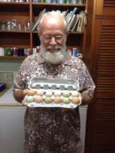 Austin showing off colorful Happy Chicken eggs