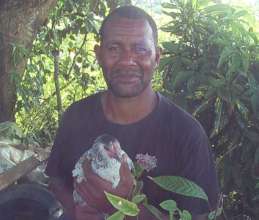 Mesake with one of his new half sized chickens