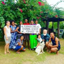 Some workshop participants holding the new sign.