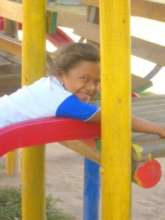 A program participant plays in a park