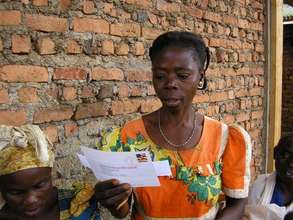 A Congolese woman reading a letter