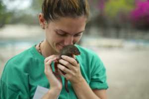 Perrine, a volunteer, with Kiwi