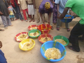 Preparing village feast at Ebola mourning ceremony