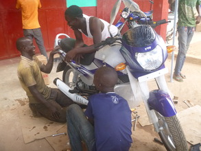 eg volunteers complete bike maintenance
