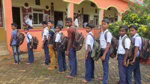 Waiting in line to collect the school kit!