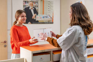 Patients or volunteers pick up meds for delivery
