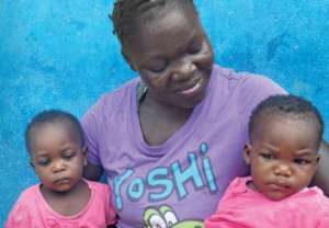 Woman and children assisted by UNFPA after Ebola