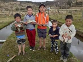 Local children with harvested trout