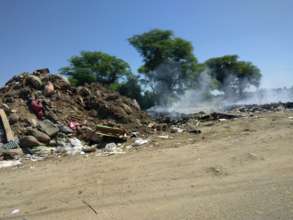 Piles of debris from the flooding dot the area