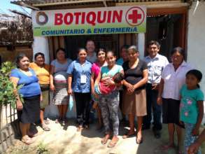 Maria with friends and their new medical facility