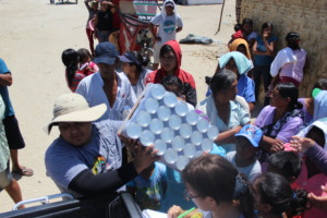 People in the refugee camp line up for food
