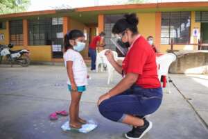 Peruvian child having a health check