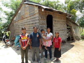 Farming Family next to their home