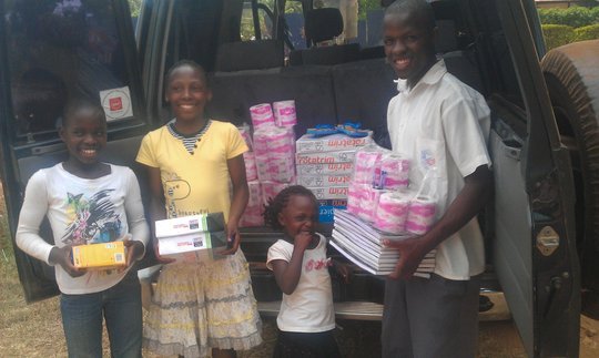 Buy scholastic materials for 20 kids in Uganda