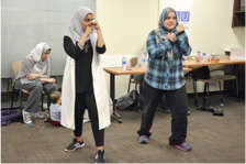 Immigrant women participate in fitness class