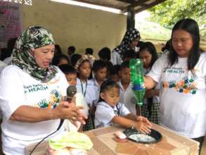 Hand wash in rural school using plastic bottle