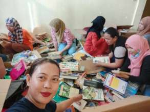 Teachers selecting books for their schools