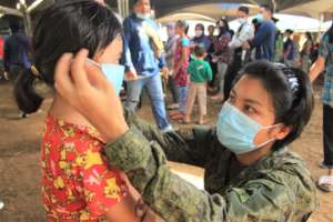 Villagers receive AAI masks from military partners