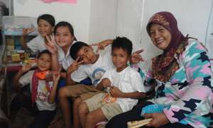 Munting Mini Nurses and their mentor at clinic