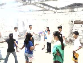 Playing in the ruins of the burned schoolhouse