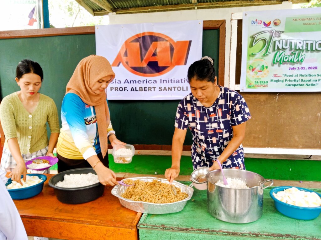 Moms and school staff prepare lunch