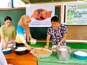 Moms and school staff prepare lunch