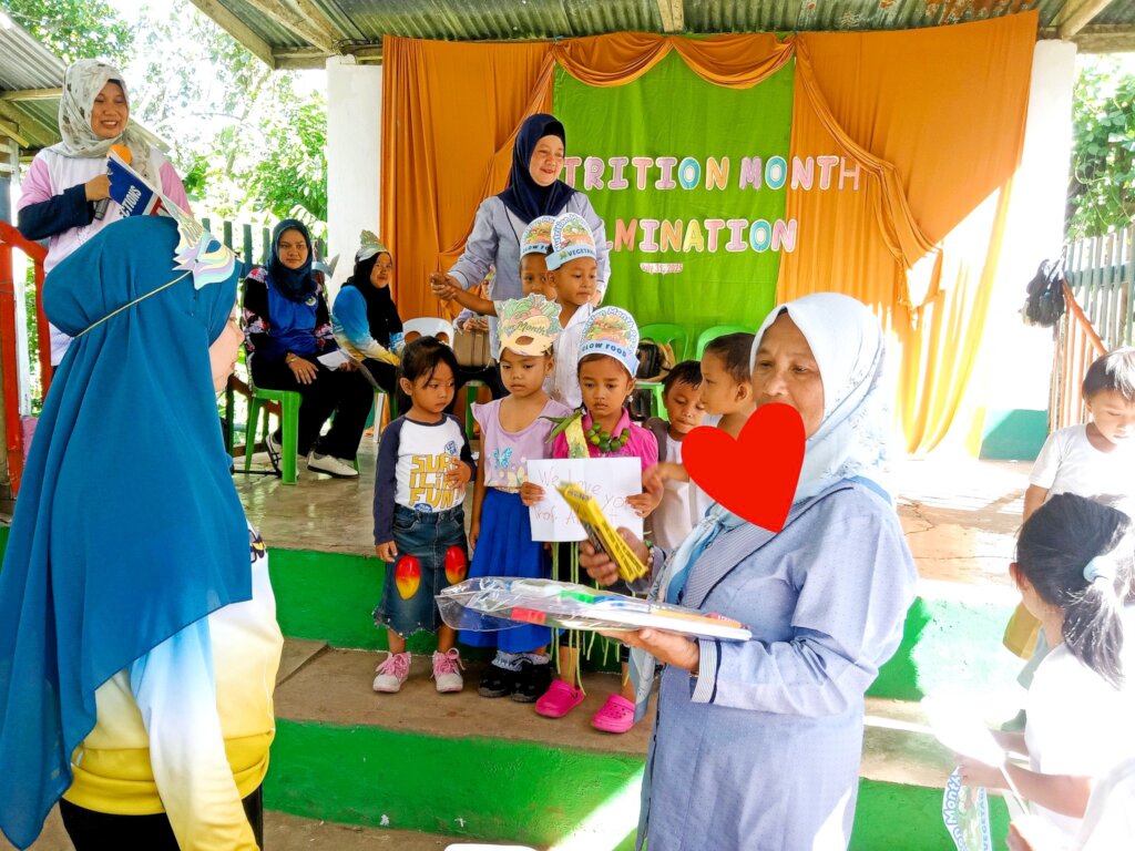 Students prepare their Nutrition Month school play