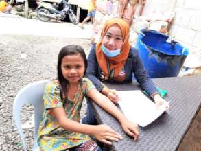 Teacher assessing student's reading skills