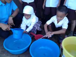 First Grade children washing at Sahaya Elementary