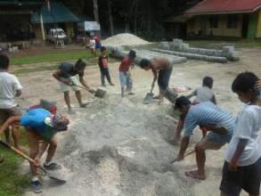 school children help Dads build new school library