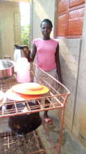 AN ORPHAN GIRL CHILD ENGAGED IN DOMESTIC WORK