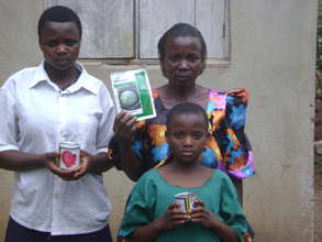 A WIDOW WITH HER ORPHAN GIRLS RECEIVES SEEDS