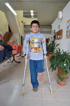 Our little super hero with his trusty crutches