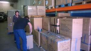 AAI in Virginia packing school supplies for Sulu