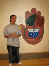 A Proud Participant Showcasing Her Mural