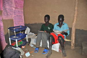 Julius in his reading hut wishing to be in school