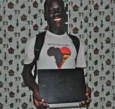 Sebastian receiving his laptop for his studies