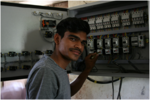 An electrician installs a new electrical system