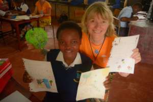 Esther with her sponsor's letters and pictures