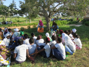 Members of the alumni group meet with students