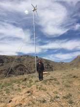 happy herdsman with wind generator