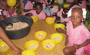 Children eating daily meal at school