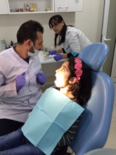 SOAR Dentist providing dental care to children