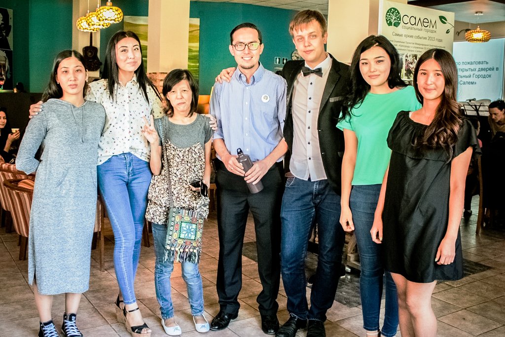 Presenters and band members pose for a photo