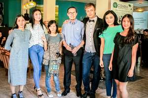 Presenters and band members pose for a photo