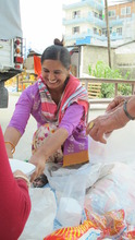 Volunteer Richel packages up food for families.