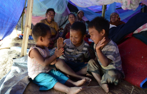 Kids playing under their new tarps