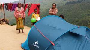 Family in Lekh with tent, food and toys